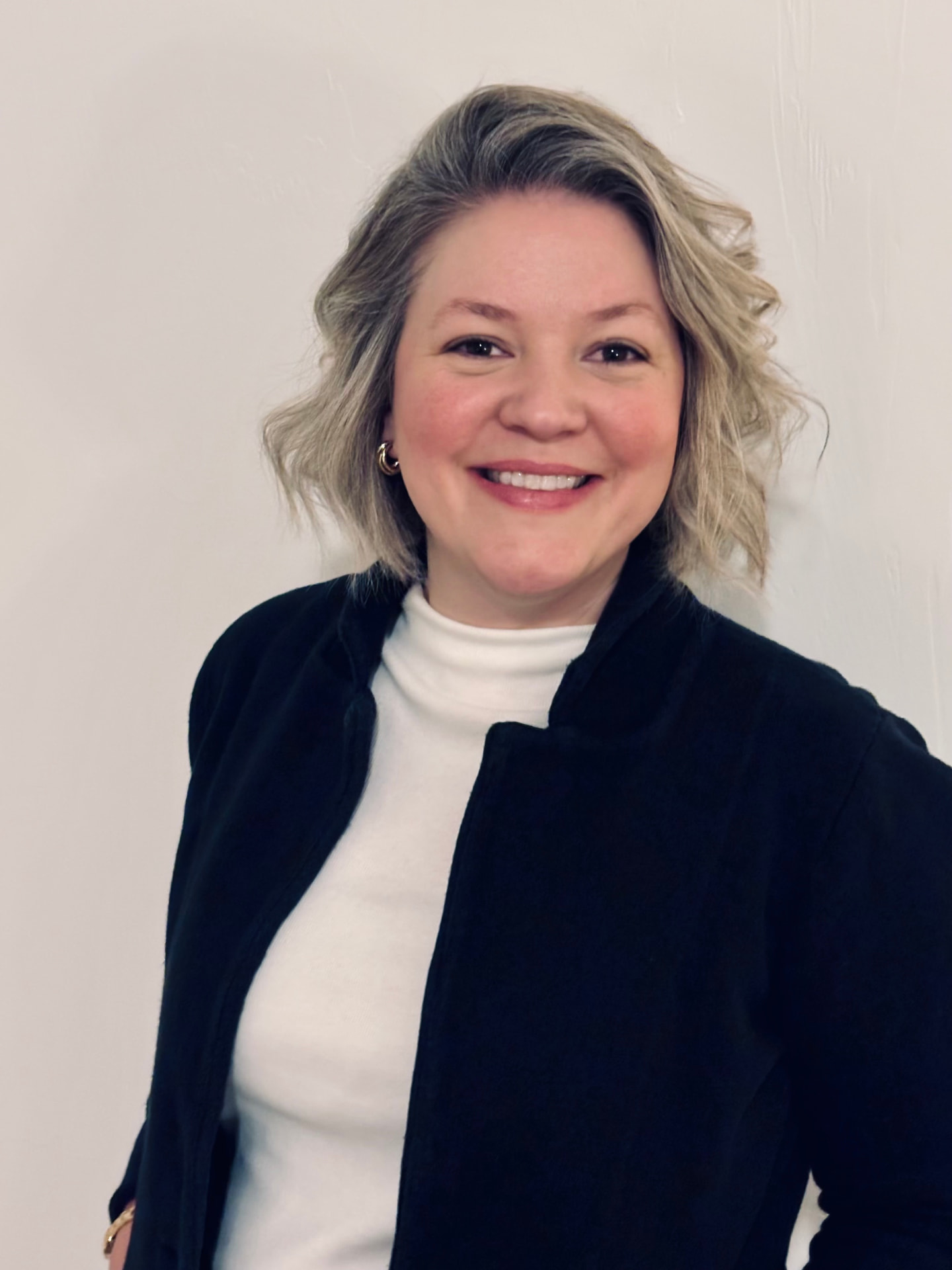 KayDee Evans smiling for a professional headshot